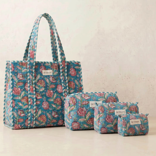 Set of floral-patterned bags on a light background