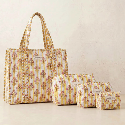 Set of floral-patterned bags on a beige background