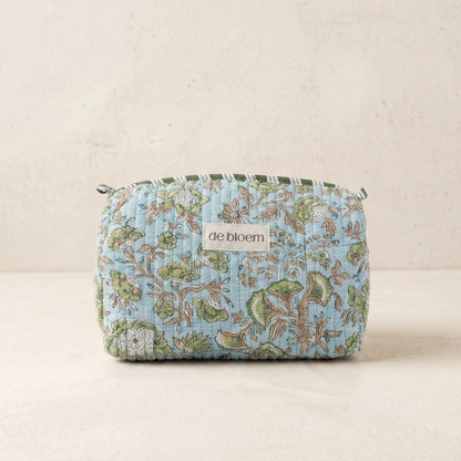 Floral patterned pouch with 'de bloem' branding on a beige background