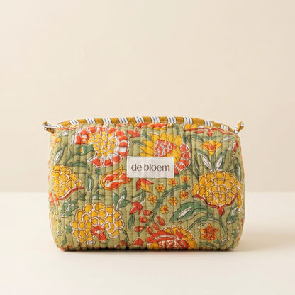 Floral-patterned pouch with 'de bloem' label on a beige background