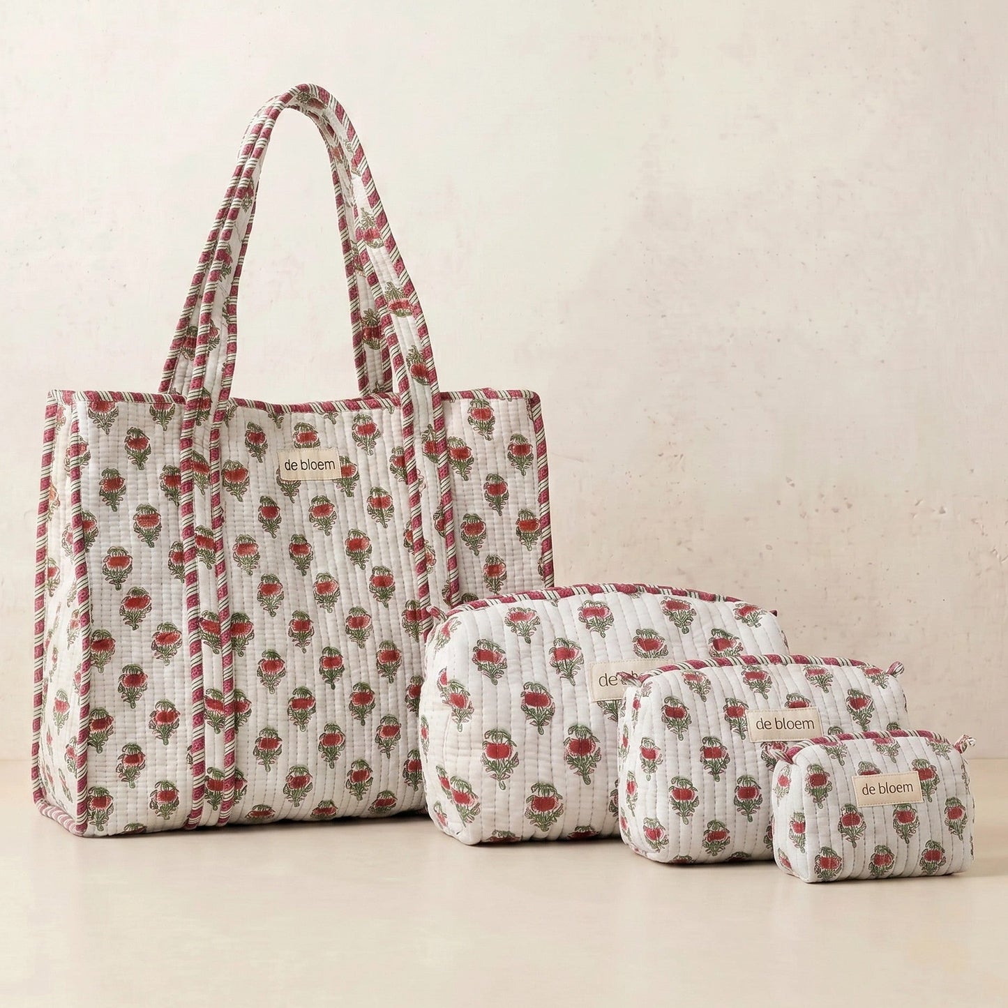 Set of fabric bags with a floral pattern on a beige background