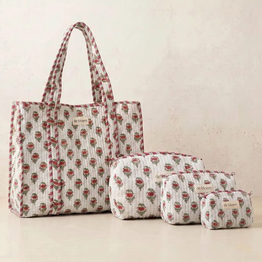 Set of fabric bags with a floral pattern on a beige background