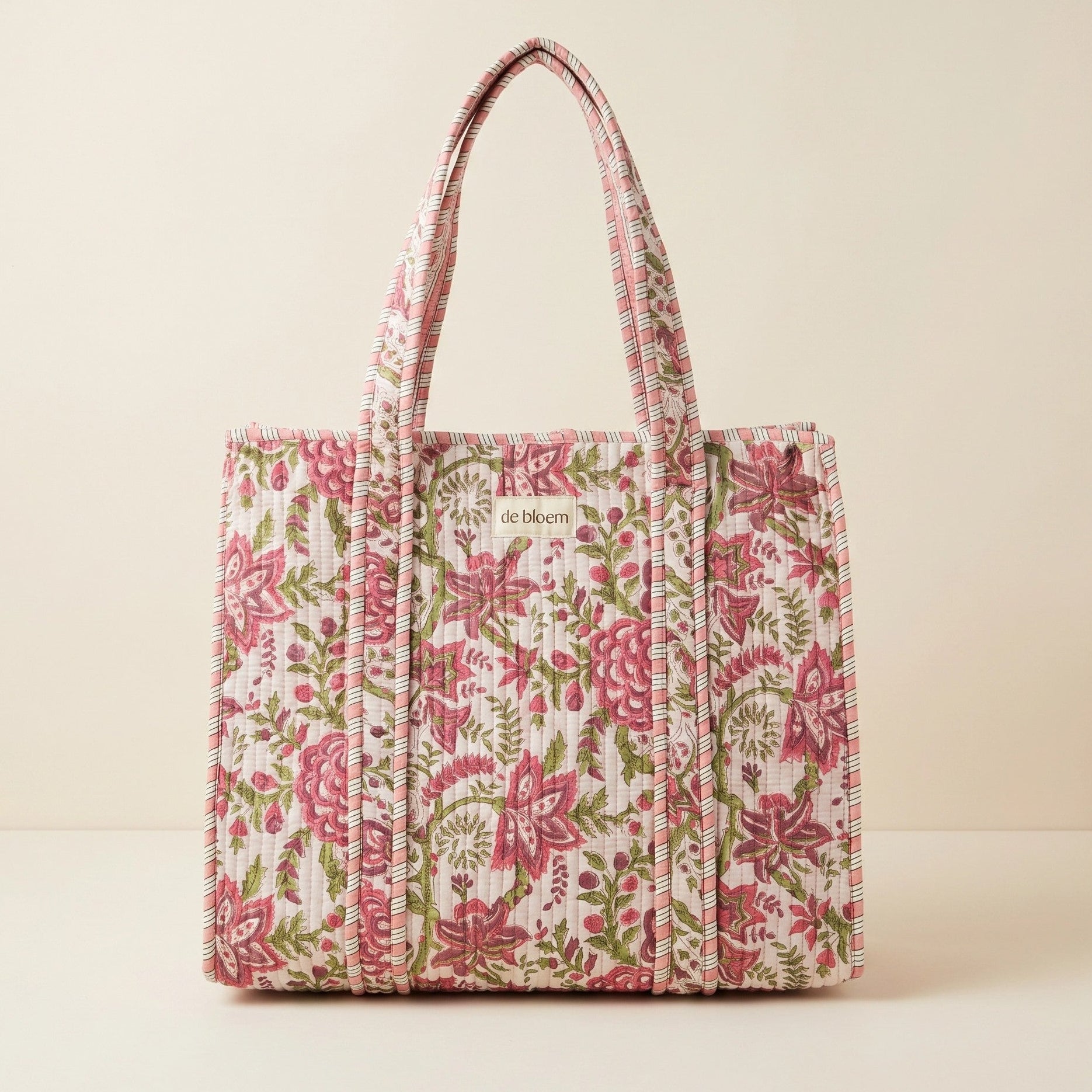 Floral patterned tote bag on a beige background