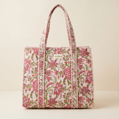 Floral patterned tote bag on a beige background
