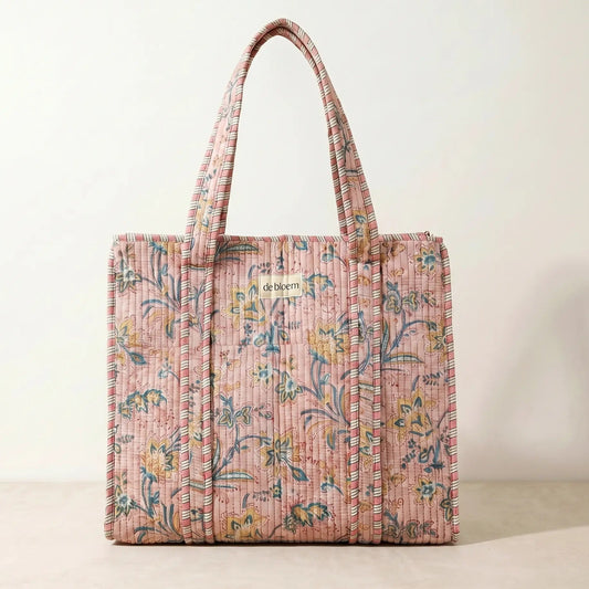 Floral patterned tote bag on a beige background