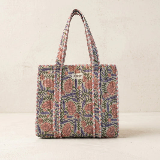Floral patterned tote bag on a beige background