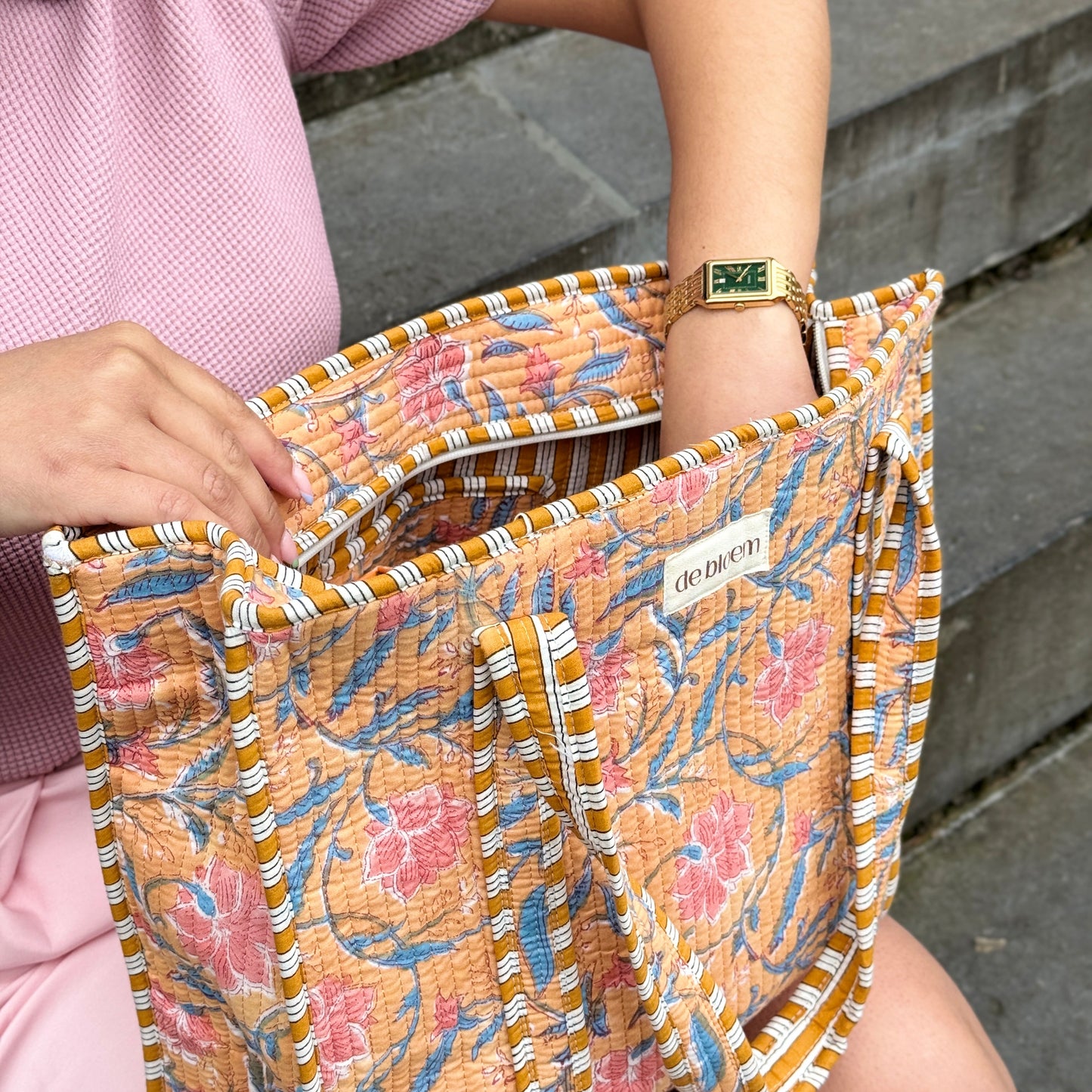 putting hand in tote bag to grab things 