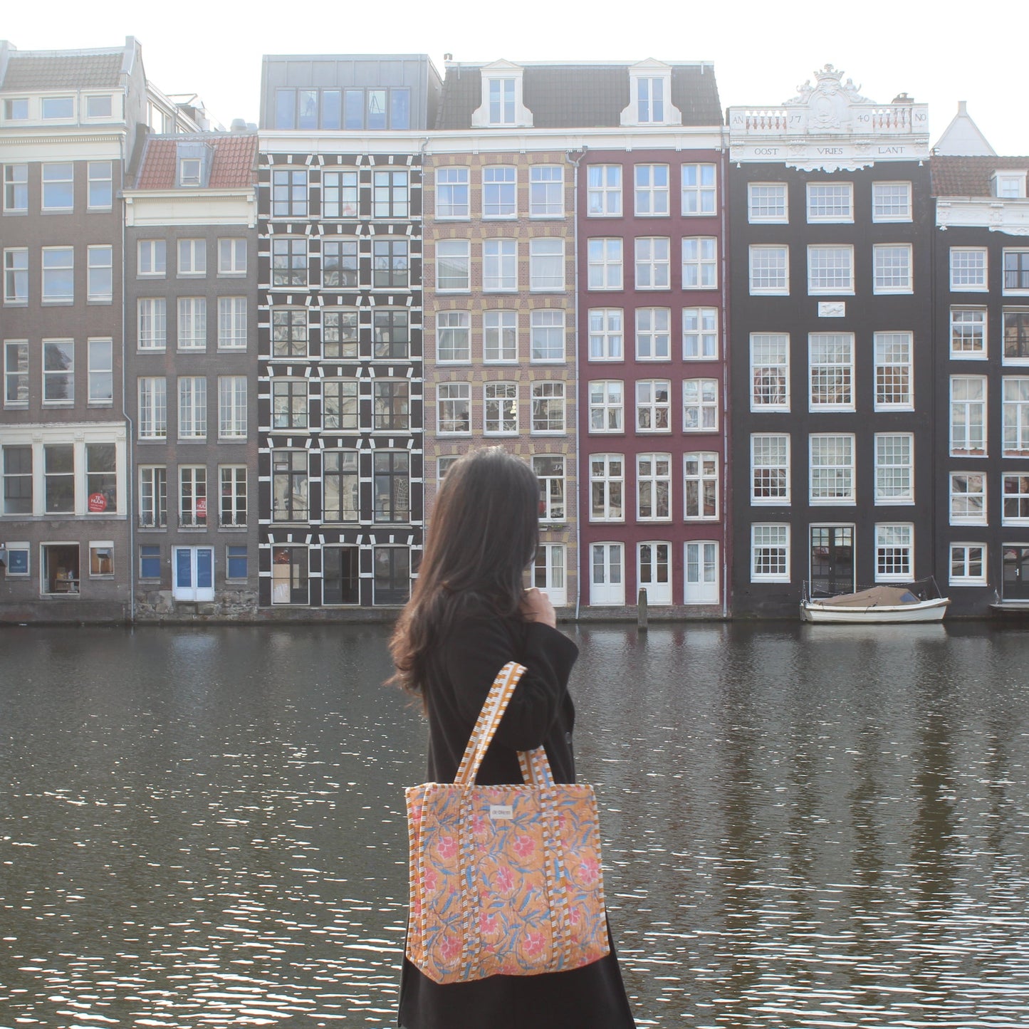 girl holding tulip tote